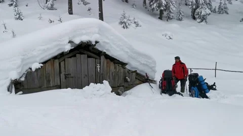 Man Clears The Door To An Abandoned Hut In The Highlands For An Overnight Sta Video stock 219949584