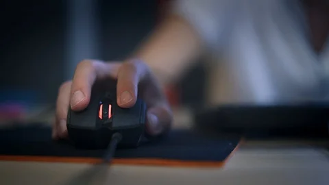 A man clicking digital mouse and working on computer. The concept of doing Stockbeeldmateriaal 114240386