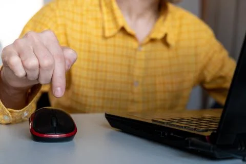 Man clicking on mouse. hand with computer mouse. Pressing button concept Photos