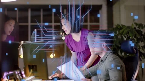 Man clicking mouse while woman pointing at monitor creating tech circuit overlay Stock Footage 334322026