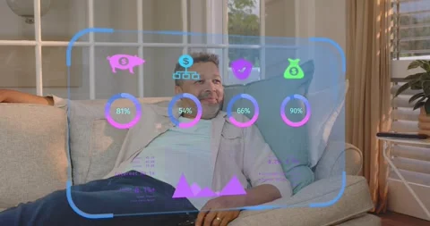 Man clicking remote on couch updating meters and shaping home tech graph to Stock Footage 322203566