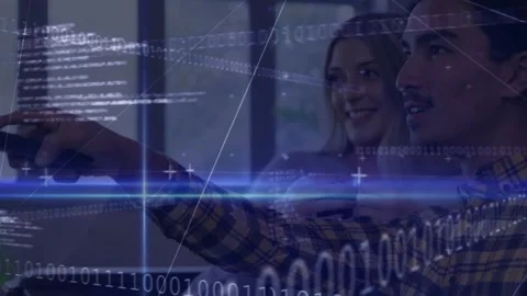 Man clicking remote on sofa causing binary tech grid shifting while woman Stock Footage 320128143
