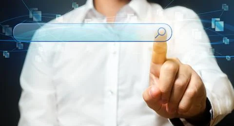 A man clicks on the button of the search bar. Search engine algorithms and .. Stock Photos