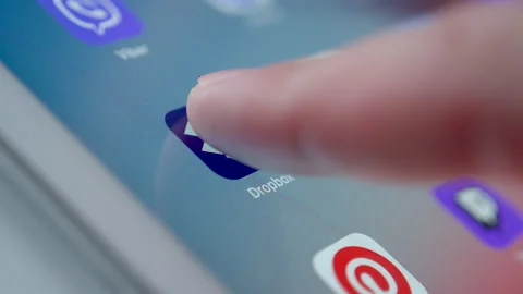 Man Clicks On Dropbox Icon App On Tablet PC Stock Footage 141705800