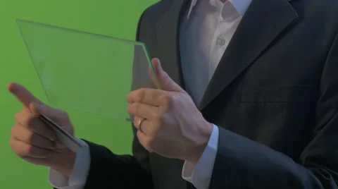 Man Clicks a Tablet Holding a Card Shows a Thumb Holding Virtual Tablet Working Stock Footage 61012307