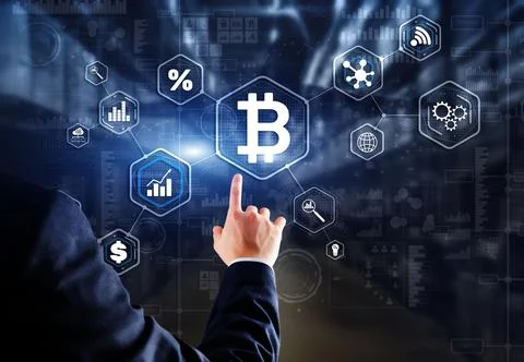 Man clicks on a virtual screen bitcoin icon Foto stock