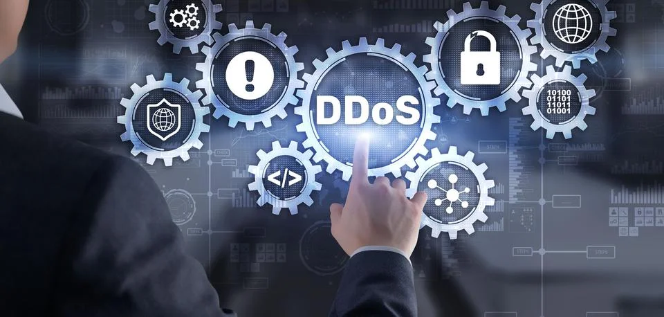 Man clicks on virtual screen with text DDoS Cyber Attack Stock Photos