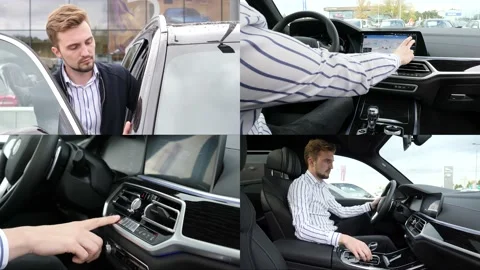 A Man Client Checks driving Systems inside a new BMW Car Stock Footage 146144677