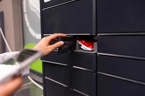 Man client using automated self service post terminal machine Stock Photos