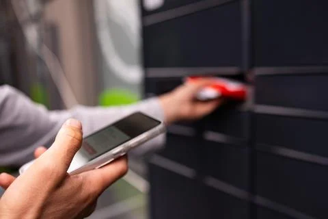 Man client using automated self service post terminal machine Stock Photos