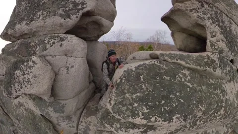 A man on a cliff. 2 Shots. 스톡 동영상 332472563