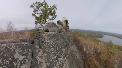 A man on a cliff. 動画素材 332351335