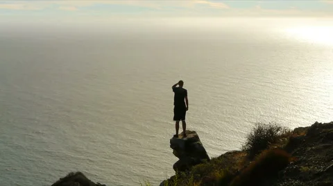 Man on Cliff Overlooking Ocean Stock-Footage 41722292