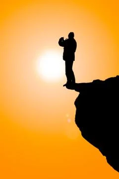 Man on the cliff Stock Photos