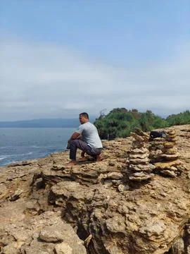 A man on the cliff Stock Photos