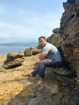 A man on the cliff Stock Photos