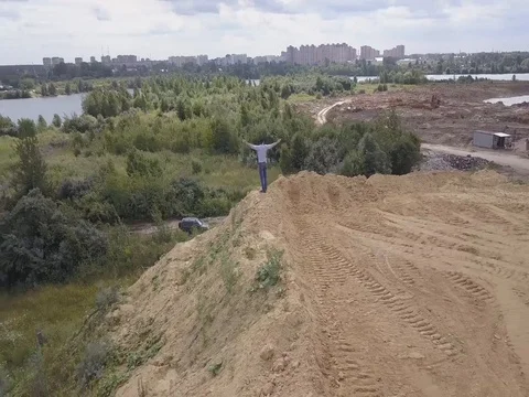 The man climbed up to the top of the hill. Win. Success. Video stock 79028876