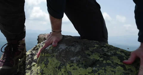 A man-climber reaches the top by doing his best. Stock Footage 247663172