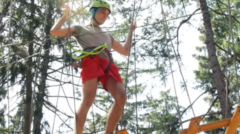 Man climbing in Adventure Park Stock Footage 64765899