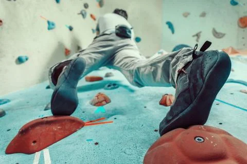 Man climbing artificial boulder Stock Photos