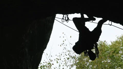 Man Climbing Up Cliff Face Stock Footage 266802096