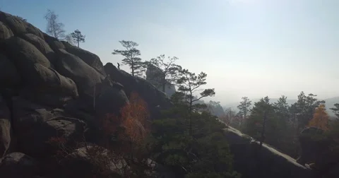 Man climbing on a cliff Stock Footage 58945130