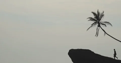 Man climbing on cliff Stock Footage 109422395