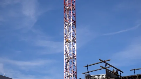 Man Climbing a Construction Crane Stock Footage 101356708