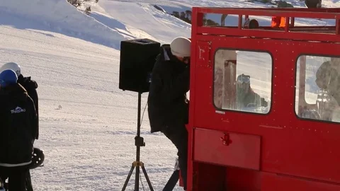 Man climbing down out of red car Stock Footage 81882259
