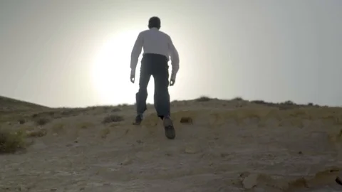 Man climbing hill 01 Stock Footage 89578379