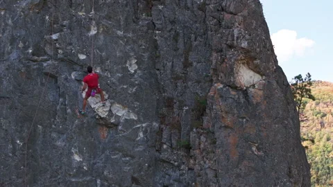 Man Climbing Up Mountain. 4K Video stock 266915154