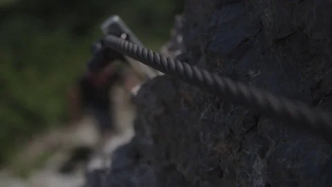 Man climbing up the mountain Stockbeeldmateriaal 76737854