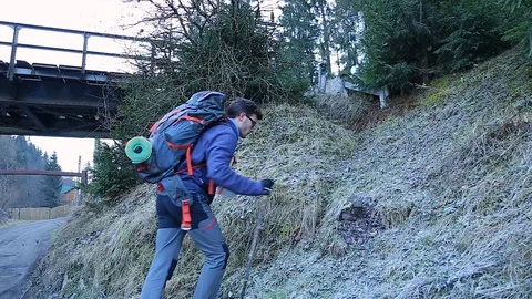 Man climbing a mountain Stock Footage 87084552
