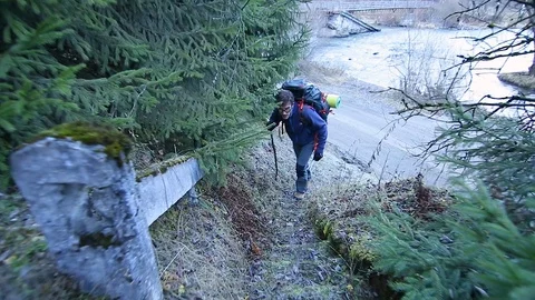 Man climbing a mountain Stock Footage 87084641