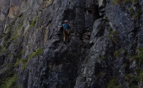 A man climbing a mountain Stock Footage 218569150