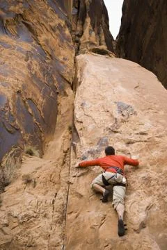 Man climbing mountain Stock Photos