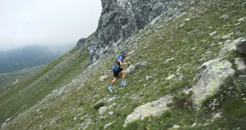Man climbing run on mountain rise.Trail runner running to top peak training on Stock Footage 108320545