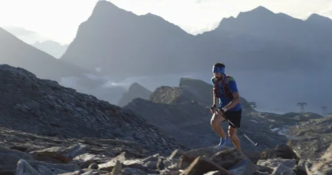Man climbing run on mountain rise.Trail runner running to top peak training on Stock-Footage 109365070