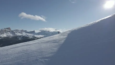 Man climbing a snowy ridge - Winter alpine landscape Video stock 230166053