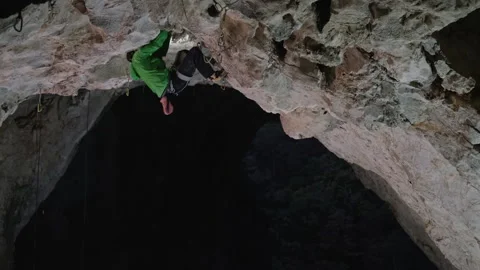 Man Climbing Steep Cliff. 4K Stock Footage 266803291