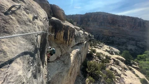 Man Climbing on Steep Rock, Stepping on Metal Rungs, Ashley Gorge Via Ferrata 스톡 동영상 344956202