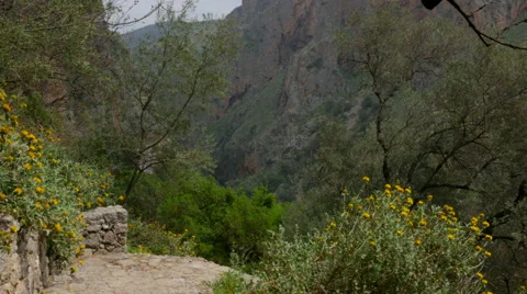 Man Climbing Steps to Agia Sofia Cave, Crete 스톡 동영상 49697999