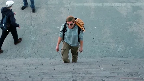 Man climbing the steps 動画素材 237200255