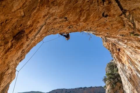 Man is climbing, training in the mountains. Stock Photos