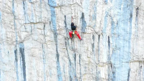 Man climbing on very steep mountain cliff, outdoors rock climbing 스톡 동영상 150554636