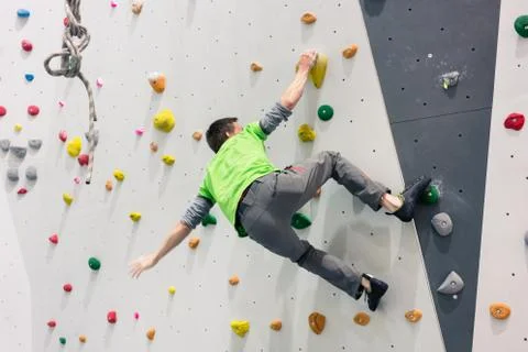 Man climbing on the wall 스톡 사진