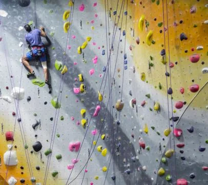 Man Climbing Wall Stock Photos