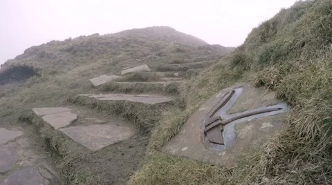 Man climbs down misty steps in Derbyshire countryside 動画素材 61723967