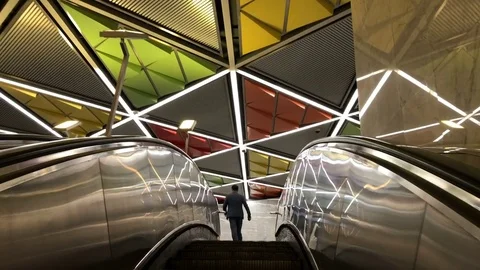 Man climbs an escalator into the city 库存影片 82228046