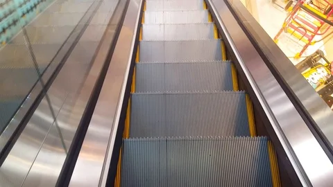 Man climbs up on the escalator Stock Footage 98160768